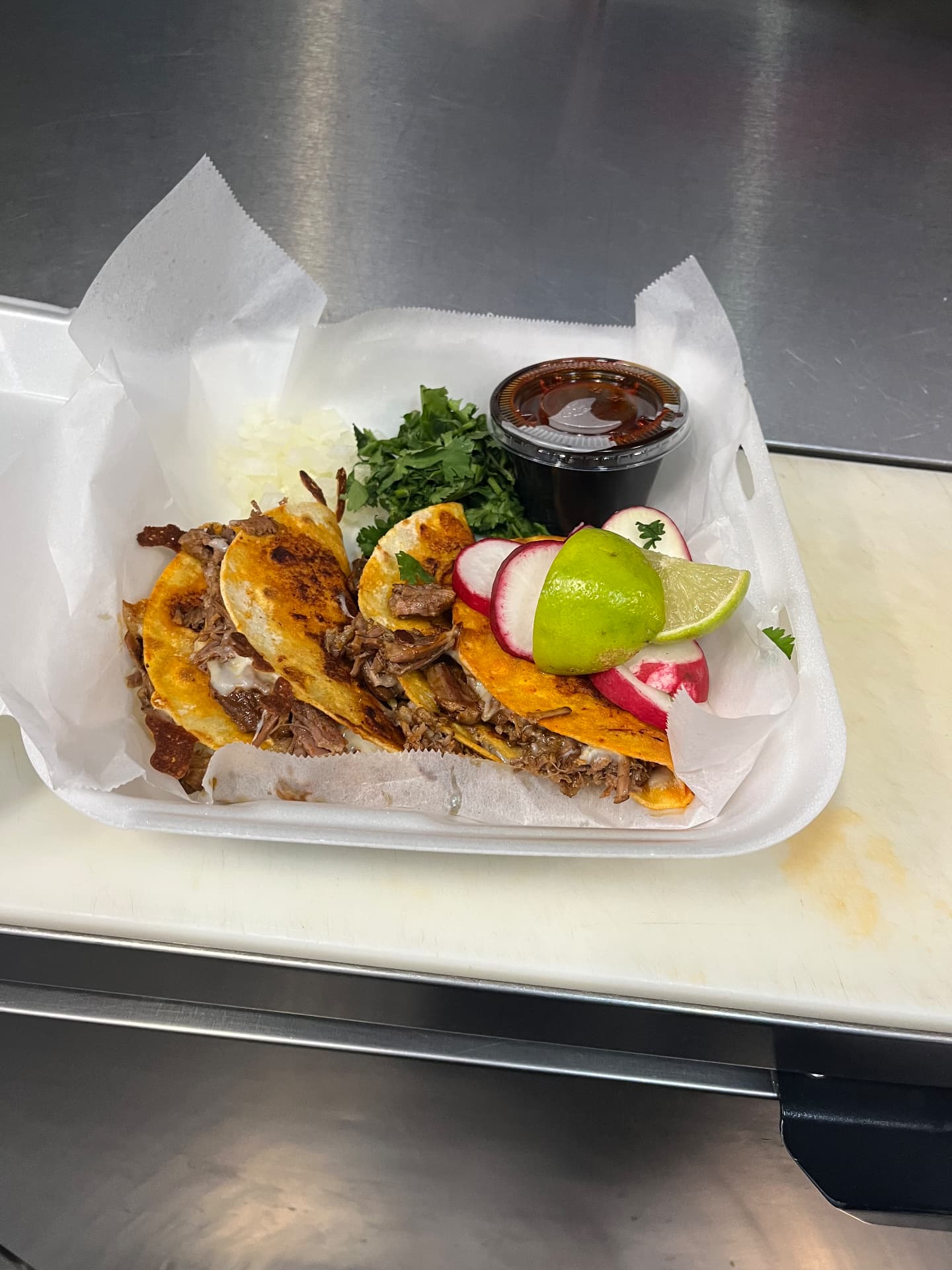 Quesabirria tacos with consomé