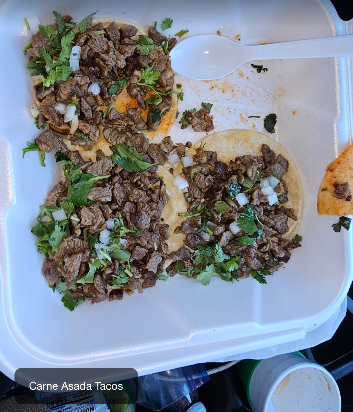 Carne asada tacos with cilantro and onion